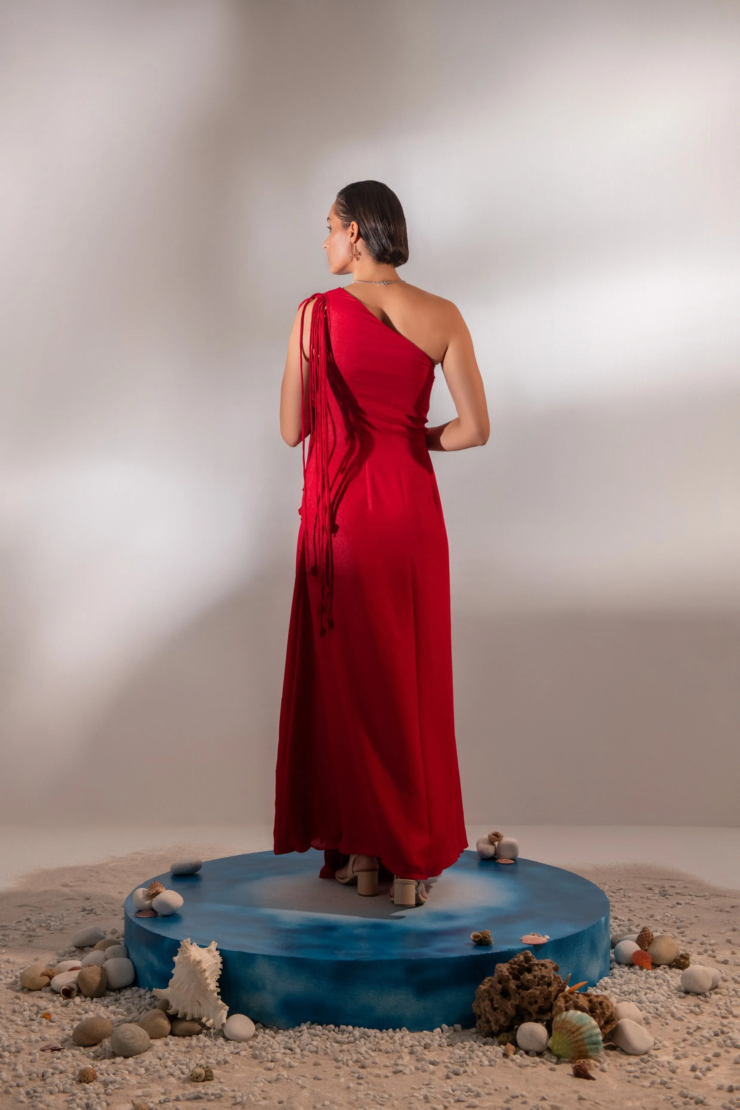Draped scarlet gown with 3d hand embroidered flower detail on front